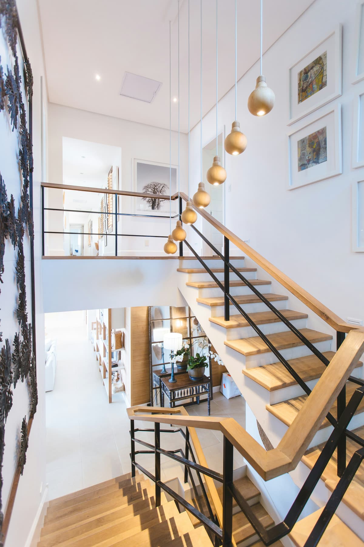 Timber staircase with painted white walls and natural wood treads